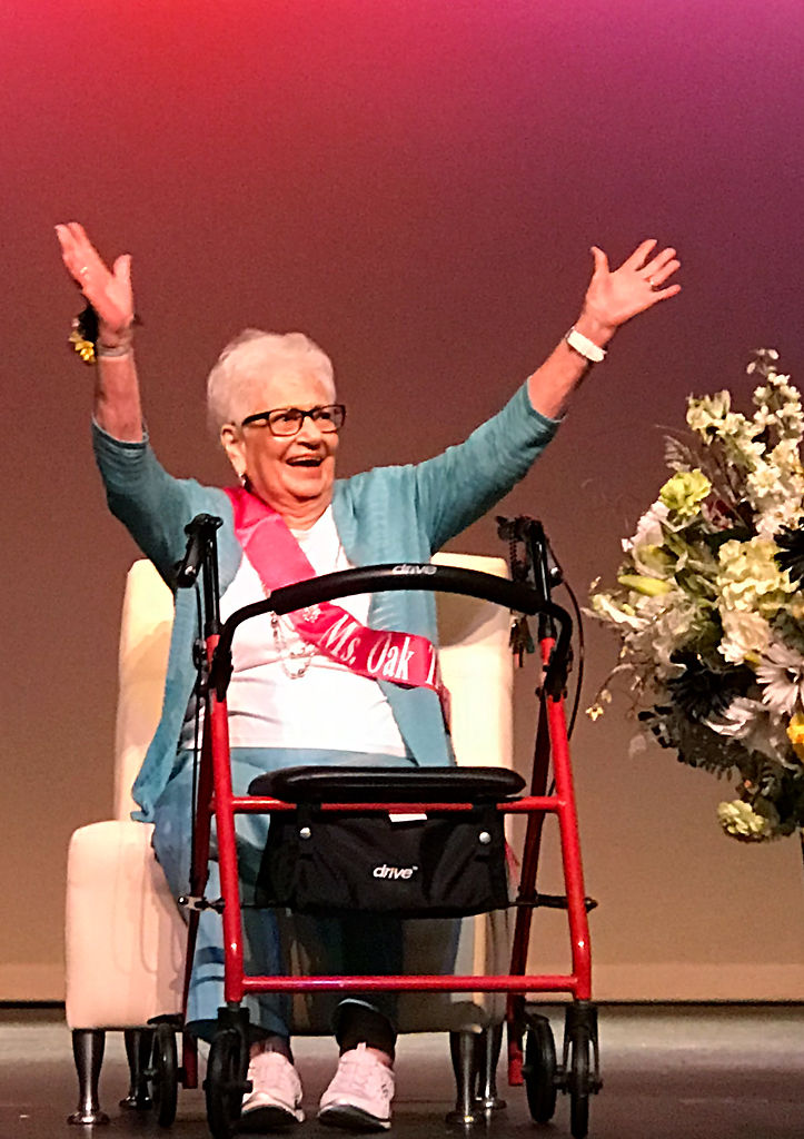 Alice Wehrle throws her hands in the air